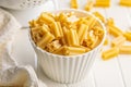 Cinque buchi. Uncooked italian pasta in bowl on white table Royalty Free Stock Photo