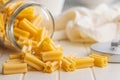 Cinque buchi. Uncooked italian pasta in jar on white table Royalty Free Stock Photo