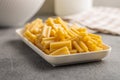 Cinque buchi. Uncooked italian pasta on plate on kitchen table Royalty Free Stock Photo