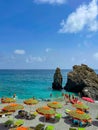 Cinque Terre beach with striped orange beach umbrellas