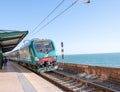 CINQUE TERRE, ITALY - APRIL 7, 2013: Train along italian coast. Royalty Free Stock Photo