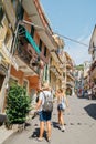 Seaside village Manarola, Colorful buildings and tourist people in Cinque Terre, Italy