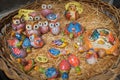 Cinque Terre, Italy - colorful ceramic animal figurines on a basket. Local souvenirs sold in Riomaggiore.