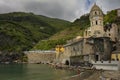 Cinque Terre, Italy. May 15, 2018. Cathedral of the coastal town of northern Italy. the train entering the tunnel on the mountain Royalty Free Stock Photo