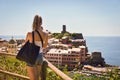 Cinque Terre, Italy - 15th August 2017:Girl taking photos with her mobile Royalty Free Stock Photo