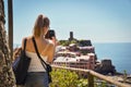 Cinque Terre, Italy - 15th August 2017:Girl taking photos with h Royalty Free Stock Photo