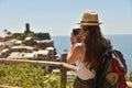 Cinque Terre, Italy - 15th August 2017:Girl taking photos with h Royalty Free Stock Photo