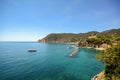 Cinque Terre: View to the beach of Monterosso al Mare with a ferry boat in early summer, Liguria Italy Royalty Free Stock Photo