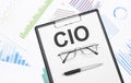 cio sign. Conceptual background with chart ,papers, pen and glasses