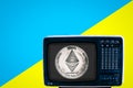 Coin eth on the Soviet analog retro TV on blue ad yellow background