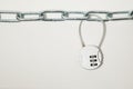 Cipher padlock on chain on white background. Security concept.