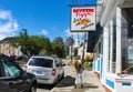 1.Mystic Conneticut USA Woman on sidewalk looking up at Mystic Pizza sign Royalty Free Stock Photo