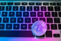 Circle Bitcoin coin on top of computer keyboard buttons. Digital currency, block chain market, online business