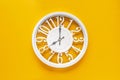 Circle clock on yellow background wall Royalty Free Stock Photo