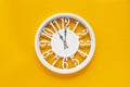 Circle clock on yellow background wall Royalty Free Stock Photo