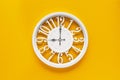 Circle clock on yellow background wall Royalty Free Stock Photo