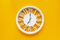 Circle clock on yellow background wall Royalty Free Stock Photo