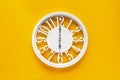 Circle clock on yellow background wall Royalty Free Stock Photo