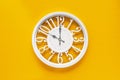 Circle clock on yellow background wall Royalty Free Stock Photo