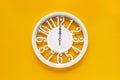 Circle clock on yellow background wall Royalty Free Stock Photo