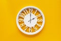 Circle clock on yellow background wall Royalty Free Stock Photo