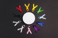 Circle of colorful awareness ribbons with place for text on black background. World cancer day concept, February 4