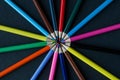 Circle of colour pencils on black background.Close up. Many different colored pencils on dark purple background.Colorful pencil Royalty Free Stock Photo