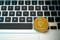 Circle Ethereum coin on top of computer keyboard buttons. Digital currency, block chain market, online business