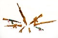 Circle of Fake AK Kalashnikov assault rifles hanging on white background