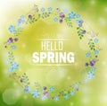 Circle floral frame with text hello spring and bokeh background Royalty Free Stock Photo