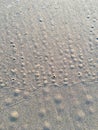 Circle and hole pattern in sand  beach texture, Crab nest, Abstract background concept Royalty Free Stock Photo