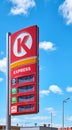 Circle K Express gas station price board in the city of Szczecin on a sunny day.