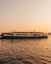 Circle Line sightseeing boat at sunset, seen from Pier 84 at Hudson River Park, in Manhattan, New York City Royalty Free Stock Photo