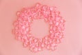 Circle made of pink plastic hearts on a pink background Royalty Free Stock Photo