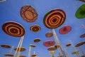 Circle made of silk, a variety of colors, in the midst of the sky. Royalty Free Stock Photo