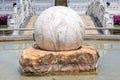 Circle marble stone on the concrete stone decoration at water garden. Royalty Free Stock Photo
