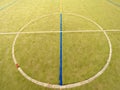Circle in middle of court. Empty outdoor handball playground, plastic light green surface Royalty Free Stock Photo