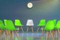 Circle of modern design chairs with one odd one out. Job opportunity. Business leadership. recruitment concept. Royalty Free Stock Photo