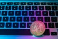 Circle Monerd coin on top of computer keyboard buttons. Digital currency, block chain market, online business