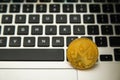 Circle Monerd coin on top of computer keyboard buttons. Digital currency, block chain market, online business
