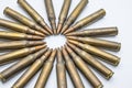 circle of old rifle cartridges 5.56 mm on a white background Royalty Free Stock Photo