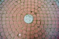 Circle pattern cobble stone, street pavement. Ancient cobblestone paved circle Royalty Free Stock Photo