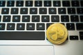 Circle Ripple coin on top of computer keyboard buttons. Digital currency, block chain market, online business Royalty Free Stock Photo