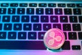 Circle Ripple coin on top of computer keyboard buttons. Digital currency, block chain market, online business Royalty Free Stock Photo