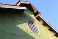 Circle shape of sun ray house on the green zinc wall and roof Royalty Free Stock Photo