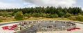 A circle shaped Garden of Remembrance with red wreathes and memorial plaques at the Commando Memorial, Lochaber, Scottish Highland Royalty Free Stock Photo