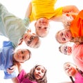 Circle of smiling kids embracing together in t-shirts Royalty Free Stock Photo