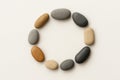 A circle of stones on a light background. Royalty Free Stock Photo
