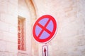 Circle traffic sign with a red cross on a blue background. No stopping or parking. Prohibiting traffic sign Royalty Free Stock Photo