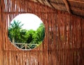 Circle window wooden cabin tropical Jungle Royalty Free Stock Photo